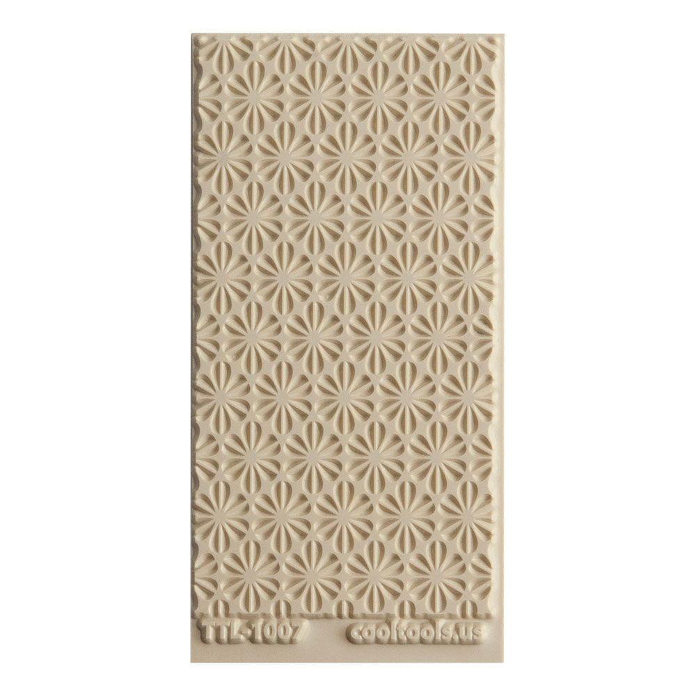 Texture Tile - Retro Daisies Embosse. Beige Texture Tiles are flexible, washable and can be used with any soft clay. Spritz with CoolSlip or dust on Dry Powder Release for stick-free impressions when using metal clay and polymer clay.d