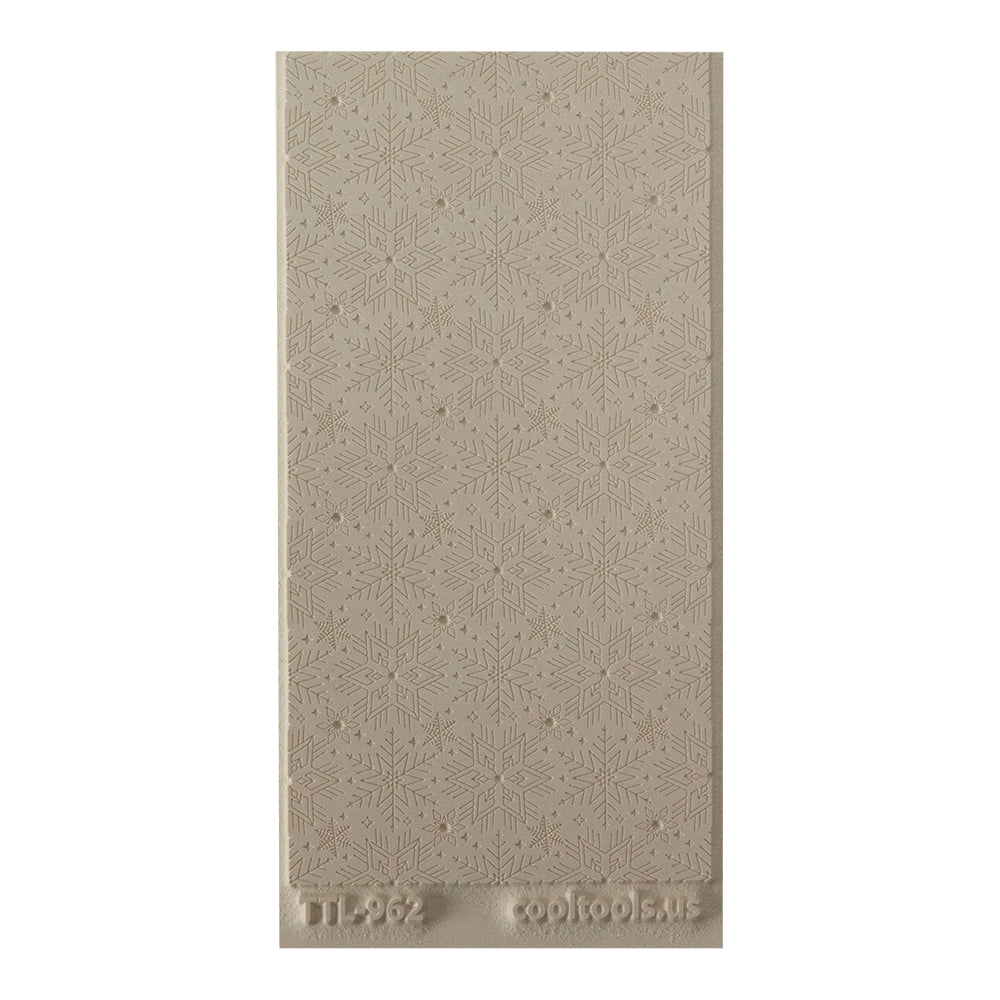Texture Tile - Snowflakes Embossed. Beige Texture Tiles are flexible, washable and can be used with any soft clay. Spritz with CoolSlip or dust on Dry Powder Release for stick-free impressions when using metal clay and polymer clay.