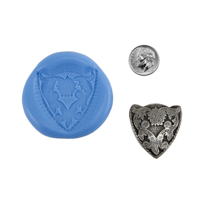 Ready Mold - Bruxelles
Sample in silver  with dime

Made from 100% silicone mold material that does not stick to metal clay, or any other type of clay, so no release is needed. Use with resin too! Molds are safe up to 500°F, so can be placed on a heat source to dry clay. Use to create a pendant, earrings or a focal point on a cuff. The photo shows a finished piece made from fine silver clay. It has been oxidized to give an antique appearance with Cool Tools Patina Gel.