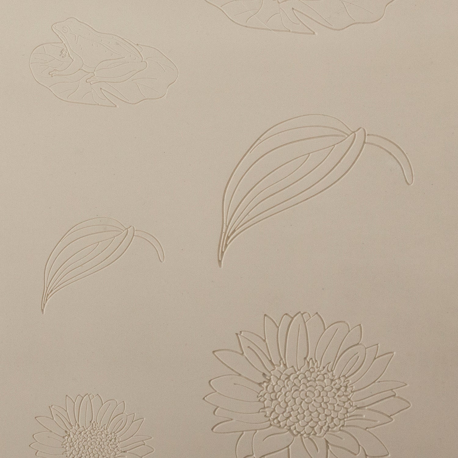 Jewelry Artist Elements - Texture - Frogs and Floral

Second picture shown is an element of the texture in clay.

Embossed elements. Impress clay, then use a Jewelry Shape Template for the shape or cut out with a needle tool. Jewelry Artist Elements are flexible, washable and can be used with any soft clay. Spritz with CoolSlip or dust on Dry Powder Release for stick-free impressions when using metal clay and polymer clay.

These beautiful texture sheets feature designs that are perfect for making many diff