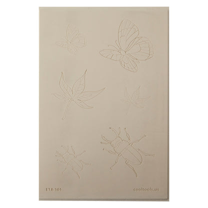 Jewelry Artist Elements - Texture - Flying and Creeping

Second picture shown is an element of the texture in clay.

Embossed elements. Impress clay, then use a Jewelry Shape Template for the shape or cut out with a needle tool. Jewelry Artist Elements are flexible, washable and can be used with any soft clay. Spritz with CoolSlip or dust on Dry Powder Release for stick-free impressions when using metal clay and polymer clay.

These beautiful texture sheets feature designs that are perfect for making many d