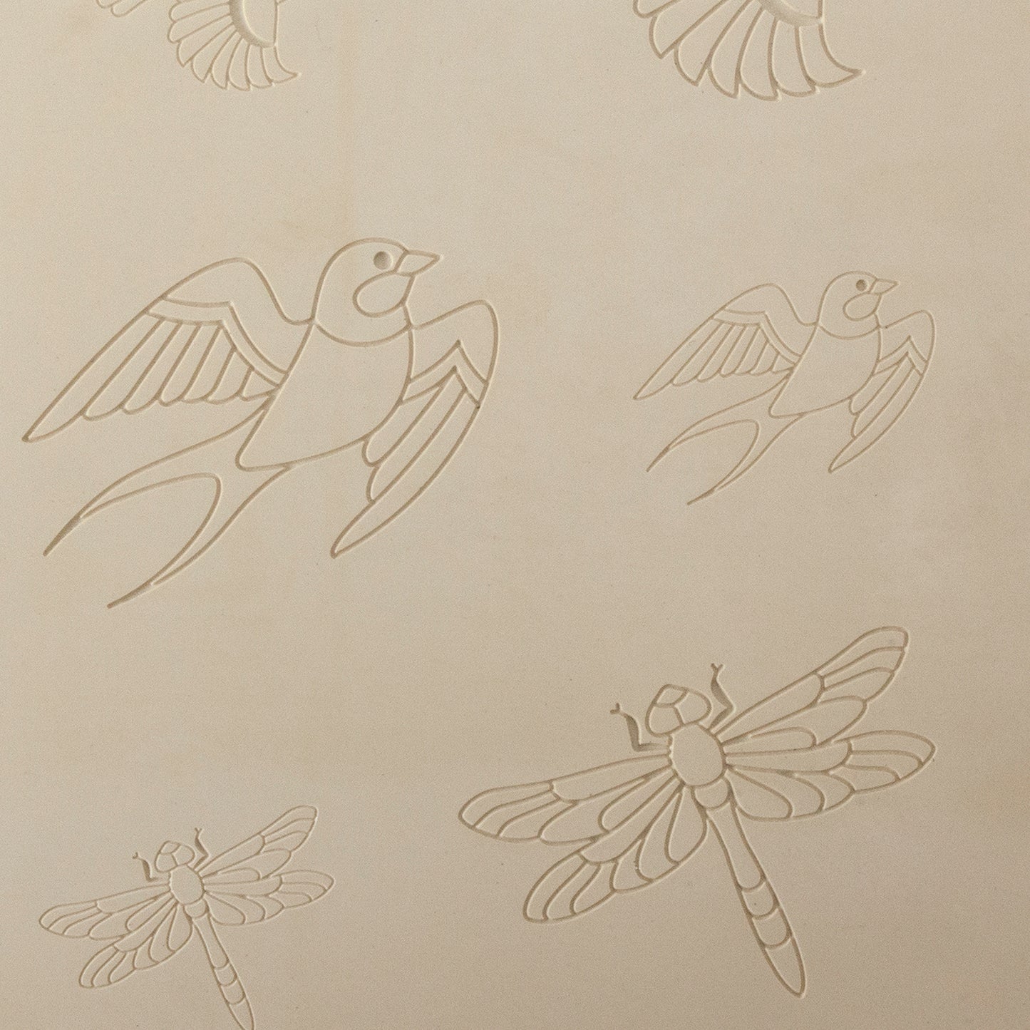 Jewelry Artist Elements - Texture - Flying Creatures 2

Second picture shown is an element of the texture in clay.

Embossed elements. Impress clay, then use a Jewelry Shape Template for the shape or cut out with a needle tool. Jewelry Artist Elements are flexible, washable and can be used with any soft clay. Spritz with CoolSlip or dust on Dry Powder Release for stick-free impressions when using metal clay and polymer clay.

Our Arts &amp; Crafts era inspired metal clay design elements are coordinating she