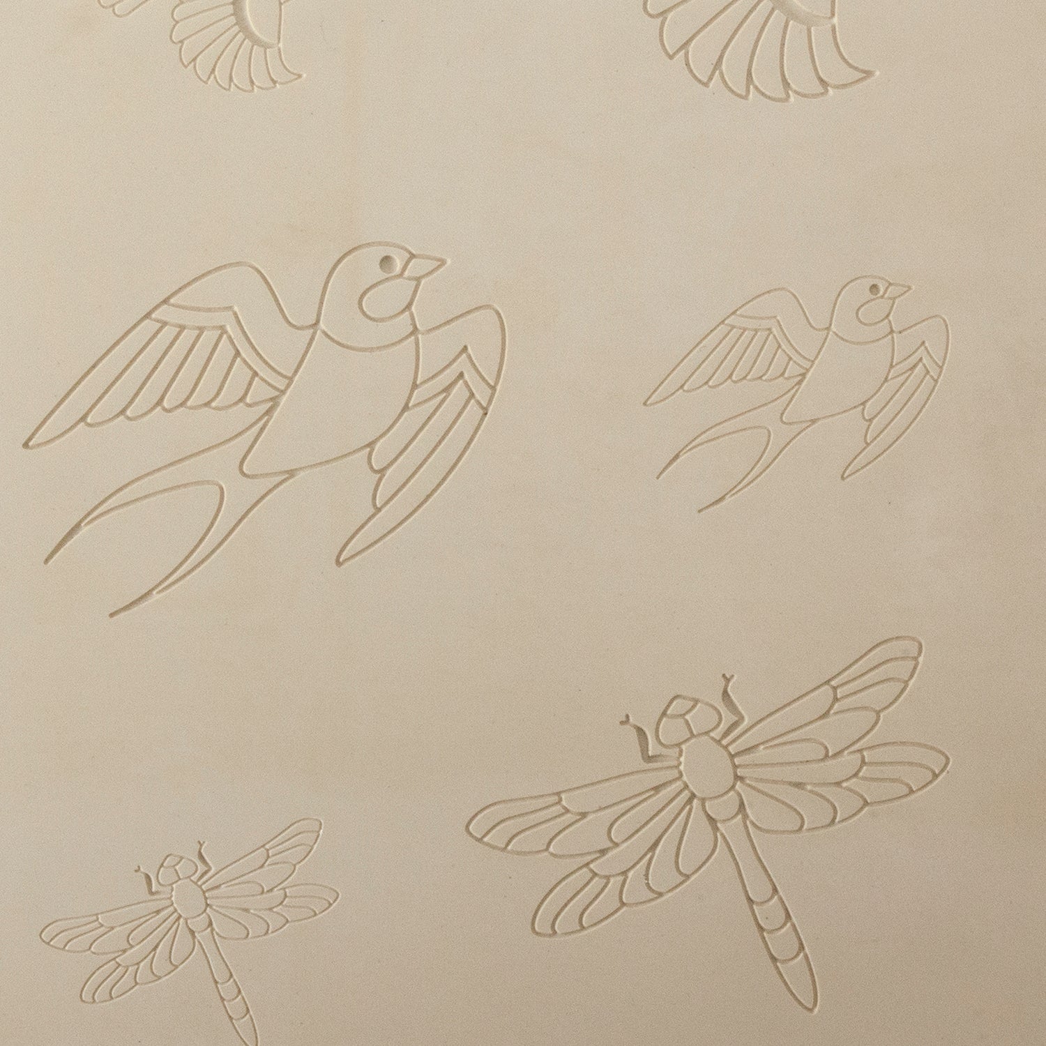 Jewelry Artist Elements - Texture - Flying Creatures 2

Second picture shown is an element of the texture in clay.

Embossed elements. Impress clay, then use a Jewelry Shape Template for the shape or cut out with a needle tool. Jewelry Artist Elements are flexible, washable and can be used with any soft clay. Spritz with CoolSlip or dust on Dry Powder Release for stick-free impressions when using metal clay and polymer clay.

Our Arts &amp; Crafts era inspired metal clay design elements are coordinating she