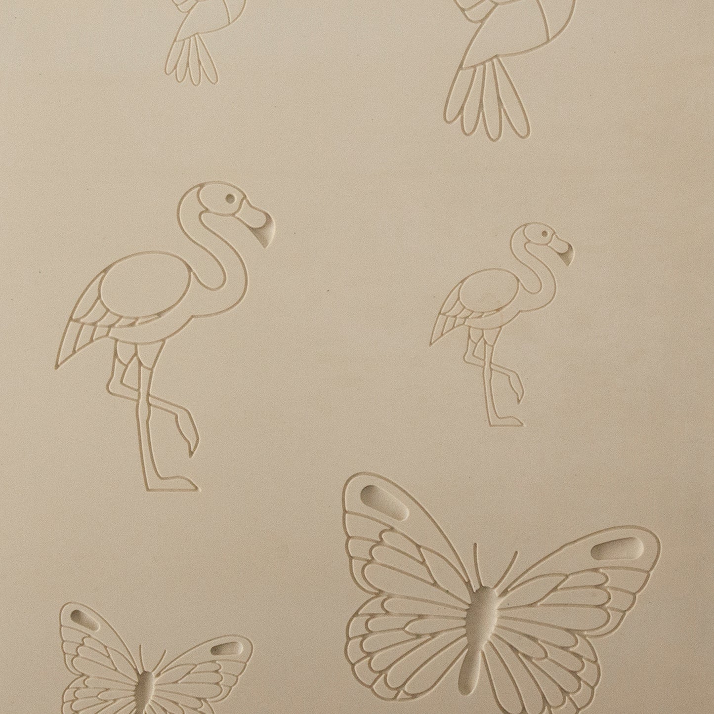 Jewelry Artist Elements - Texture - Flying Creatures 3

Second picture shown is an element of the texture in clay.

Embossed elements. Impress clay, then use a Jewelry Shape Template for the shape or cut out with a needle tool. Jewelry Artist Elements are flexible, washable and can be used with any soft clay. Spritz with CoolSlip or dust on Dry Powder Release for stick-free impressions when using metal clay and polymer clay.

These beautiful texture sheets feature designs that are perfect for making many di