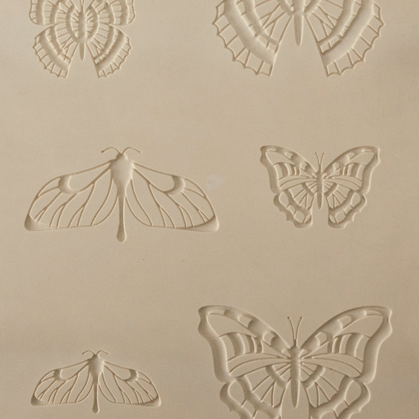 Jewelry Artist Elements - Texture - Butterfly 2

Second picture shown is an element of the texture in clay.

Embossed elements. Impress clay, then use a Jewelry Shape Template for the shape or cut out with a needle tool. Jewelry Artist Elements are flexible, washable and can be used with any soft clay. Spritz with CoolSlip or dust on Dry Powder Release for stick-free impressions when using metal clay and polymer clay.

These beautiful texture sheets feature designs that are perfect for making many different