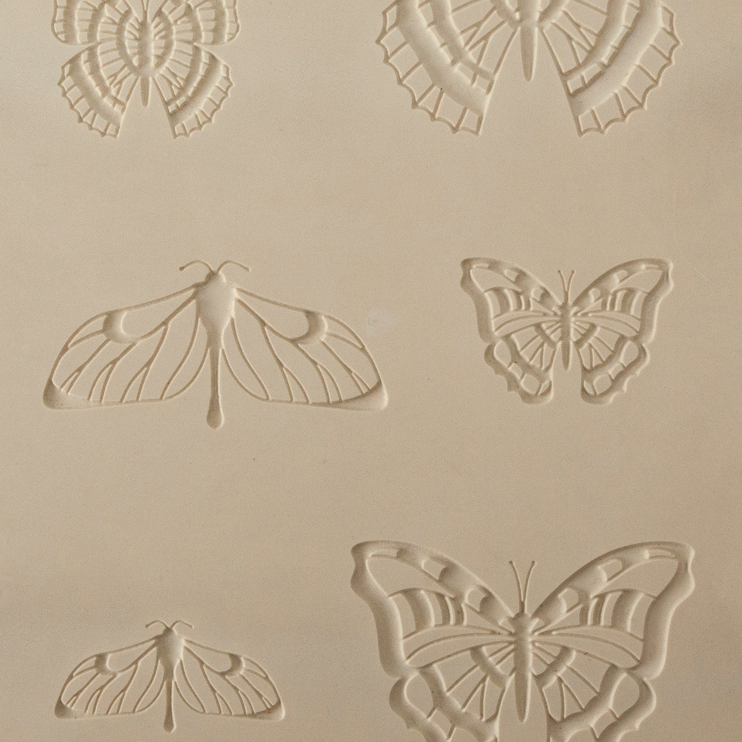 Jewelry Artist Elements - Texture - Butterfly 2

Second picture shown is an element of the texture in clay.

Embossed elements. Impress clay, then use a Jewelry Shape Template for the shape or cut out with a needle tool. Jewelry Artist Elements are flexible, washable and can be used with any soft clay. Spritz with CoolSlip or dust on Dry Powder Release for stick-free impressions when using metal clay and polymer clay.

These beautiful texture sheets feature designs that are perfect for making many different