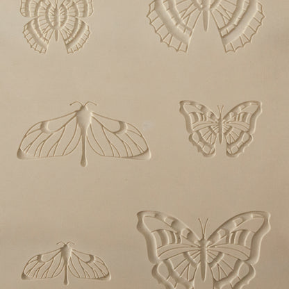 Jewelry Artist Elements - Texture - Butterfly 2

Second picture shown is an element of the texture in clay.

Embossed elements. Impress clay, then use a Jewelry Shape Template for the shape or cut out with a needle tool. Jewelry Artist Elements are flexible, washable and can be used with any soft clay. Spritz with CoolSlip or dust on Dry Powder Release for stick-free impressions when using metal clay and polymer clay.

These beautiful texture sheets feature designs that are perfect for making many different