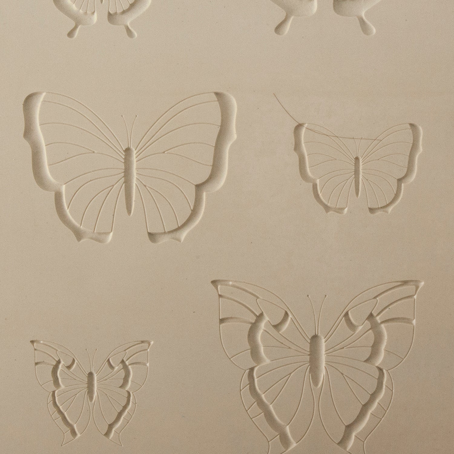 Jewelry Artist Elements - Texture - Butterfly 3

Second picture shown is an element of the texture in clay.

Embossed elements. Impress clay, then use a Jewelry Shape Template for the shape or cut out with a needle tool. Jewelry Artist Elements are flexible, washable and can be used with any soft clay. Spritz with CoolSlip or dust on Dry Powder Release for stick-free impressions when using metal clay and polymer clay.

These beautiful texture sheets feature designs that are perfect for making many different
