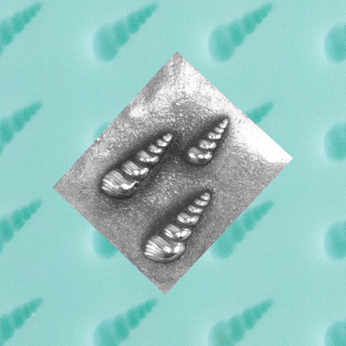 green silicone Finishing Touches Mold - Spiral Shell with silver sample