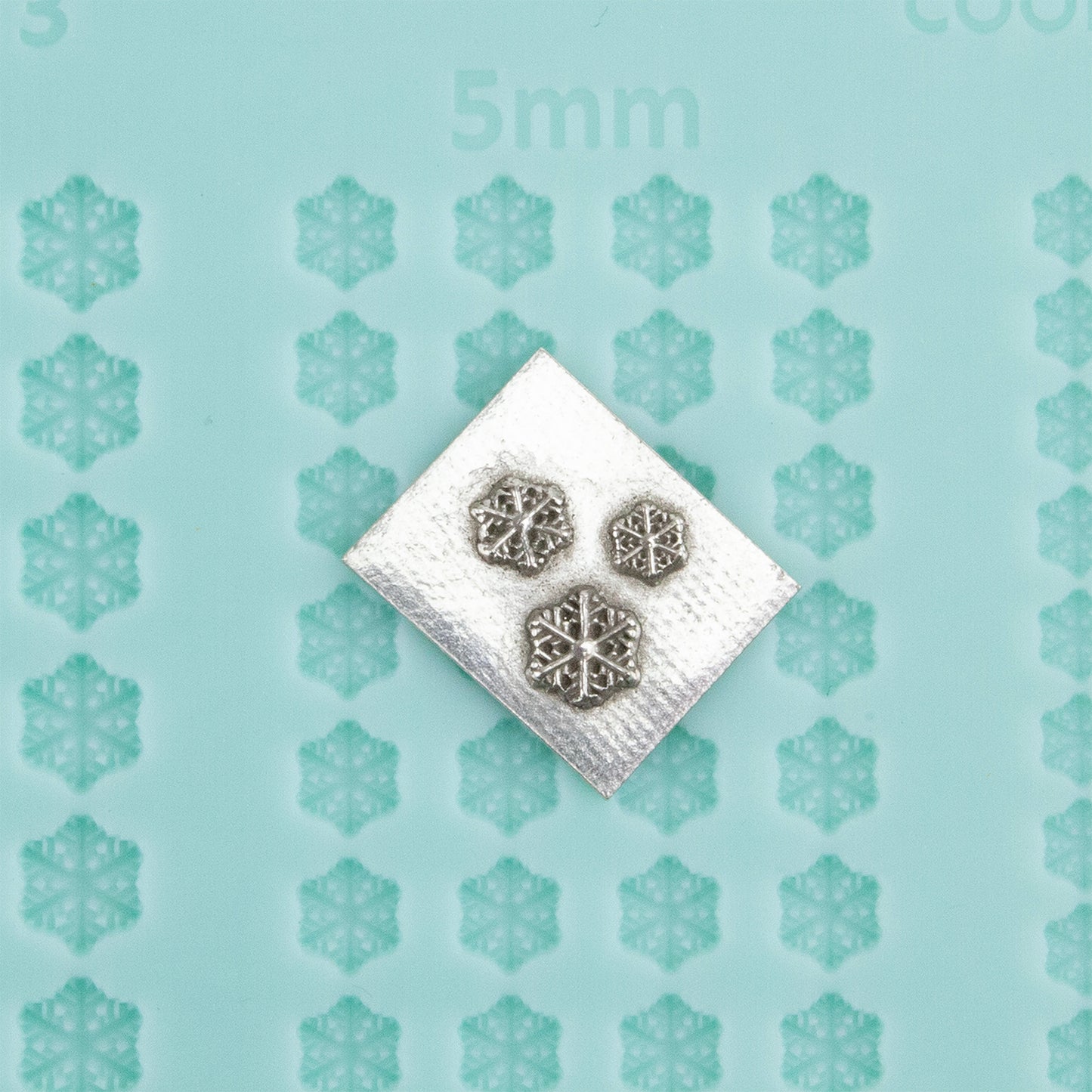 green silicone Finishing Touches Mold - Snowflake 3 with silver sample 