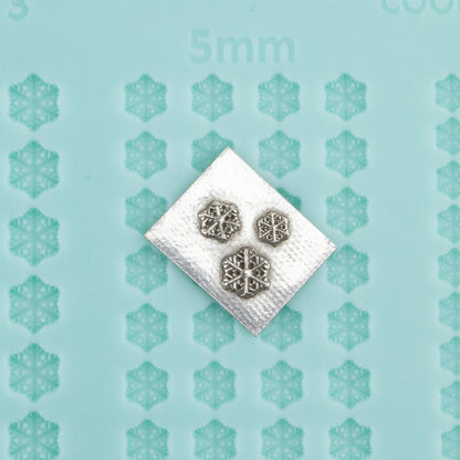 green silicone Finishing Touches Mold - Snowflake 3 with silver sample 
