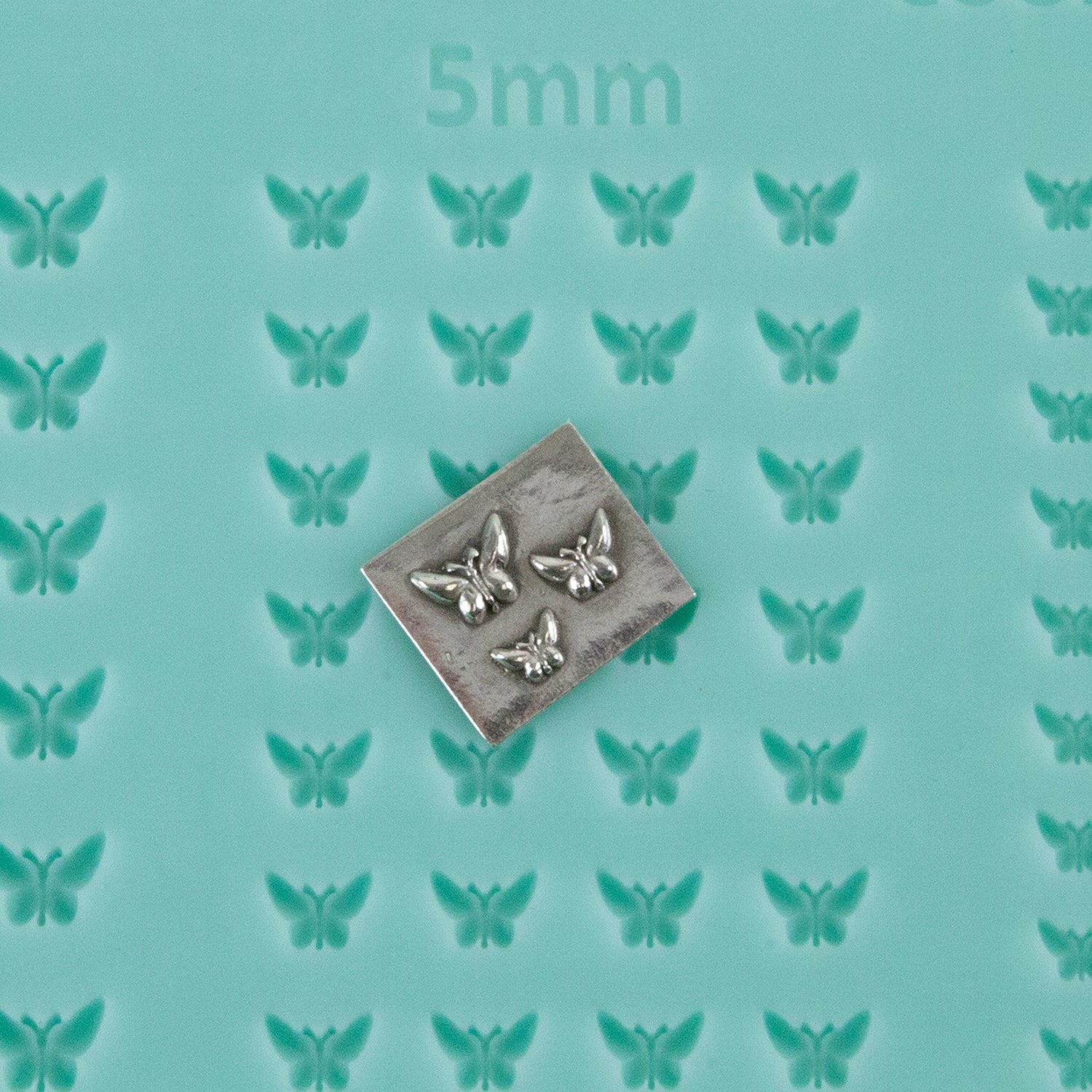 green silicone Finishing Touches Mold - Butterfly 1 with silver sample