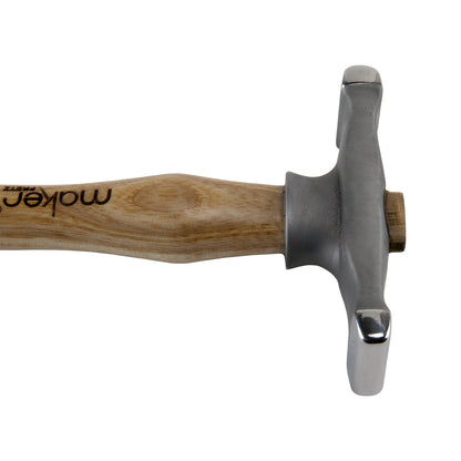 Fretz - Maker Narrow Raising Hammer

The Maker Narrow Raising Hammer is a crosspein used to sink metal into concave shapes and fit into curves where a round planishing hammer will not fit. The hammer also leaves a dramatic texture on flat, concave and convex metal and jewelry.
Each hammer in the Maker line is made with a signature 420 stainless steel and have polished faces ready for use. The handles are North American ash with the logo on the handle.