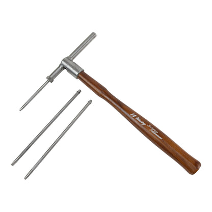 Whaley Sliding Hammer

The Whaley Sliding Hammer makes it easier than ever to move your metal in a very careful and precise way. This revolutionary tool has a slender, hollow hammer head which holds a long punch that slides back and forth within the hammer head. Great for stone setting, channel setting, riveting, repousse, texturing, chasing and more.