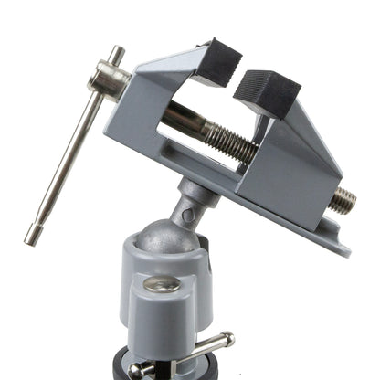 Economy Tabletop Swivel Vise

The jaws open up to 2-1/4" wide and are lined with tough rubber that will not scratch precious metals. The clamp opens up to 2-1/8" wide to fit any bench or table. The ball and socket configuration allows the jaws to be tilted and rotate 360 degrees as the jaws hold firmly in place at any angle.