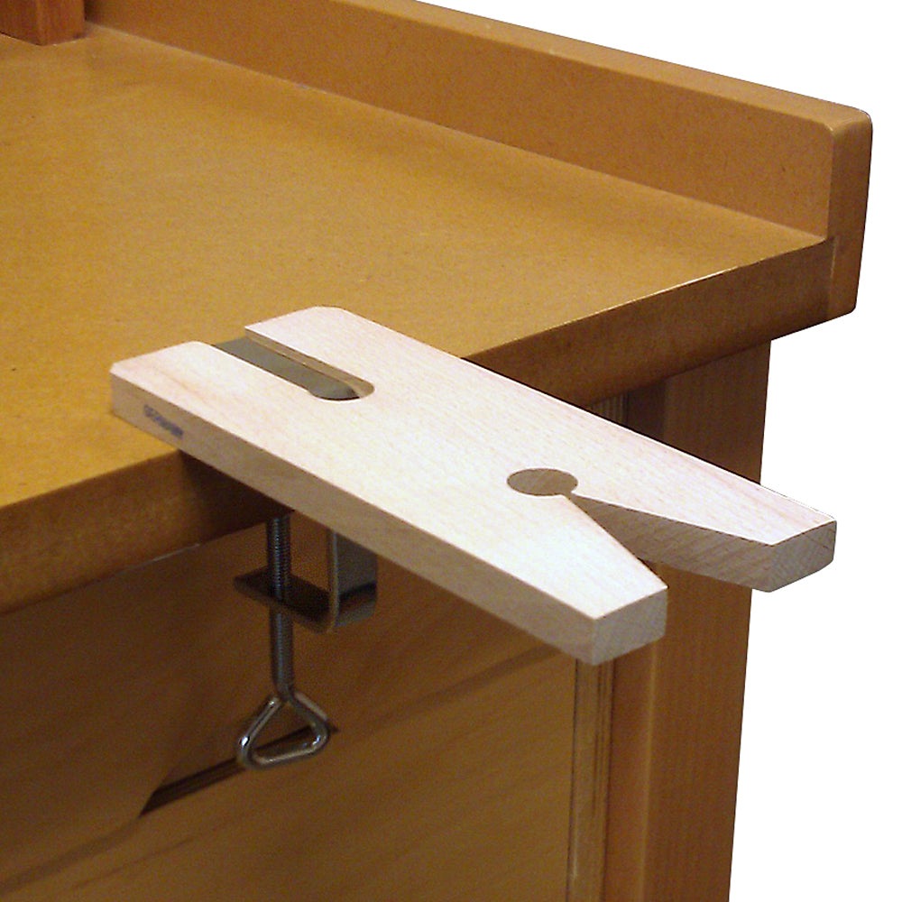 V-Slot Bench Pin with Clamp mounted to bench. Indispensable to any workbench for sawing and working on various materials. Ours is quality hardwood with a deluxe clamp made in Germany. Clamps easily onto bench edge up to 1-3/4 thick.