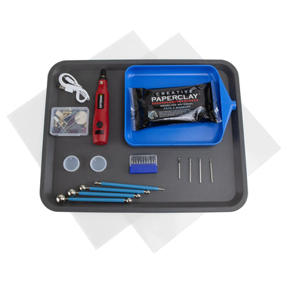 Craftcast Kit: Successful Carving Techniques in Metal Clay Revealed: This kit includes:   Jangklife cordless rotary tool with attachments   2 Clear acrylic safety shields 12" x 12"  1 Safety shield holder tray   2 Round silicone jewelry molds for resin  10 Micro diamond burs in stand  4 Large double-ended steel ball tip sculpting tools  2 round burs - 040 and 020  4 oz Creative Paperclay®   1 Knife edge wheel diamond bur - 4mm