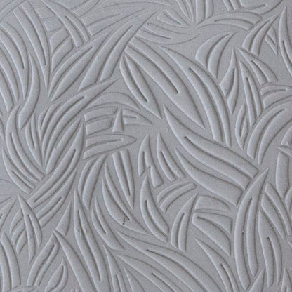 sample in clay of Mega Texture Tile - Grass Embossed. Use to impress texture in soft clays. Mega Texture Tiles are perfect for projects both large and small. Mega Tiles measure 9-1/4" x 6" and are about 7 times larger than Texture Tiles. These textures are flexible, washable and can be used with any soft clay.