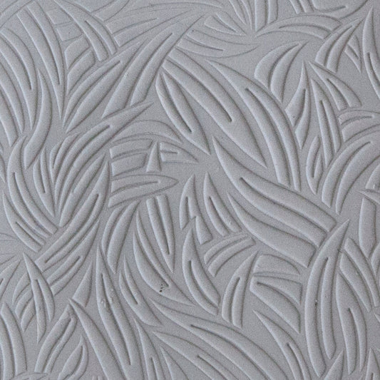 sample in clay of Mega Texture Tile - Grass Embossed. Use to impress texture in soft clays. Mega Texture Tiles are perfect for projects both large and small. Mega Tiles measure 9-1/4" x 6" and are about 7 times larger than Texture Tiles. These textures are flexible, washable and can be used with any soft clay.