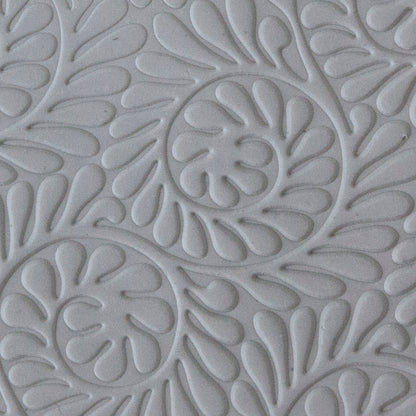 sample in clay of Mega Texture Tile - Fiddlehead Fern Embossed. Use to impress texture in soft clays. Mega Texture Tiles are perfect for projects both large and small. Mega Tiles measure 9-1/4" x 6" and are about 7 times larger than Texture Tiles. These textures are flexible, washable and can be used with any soft clay.