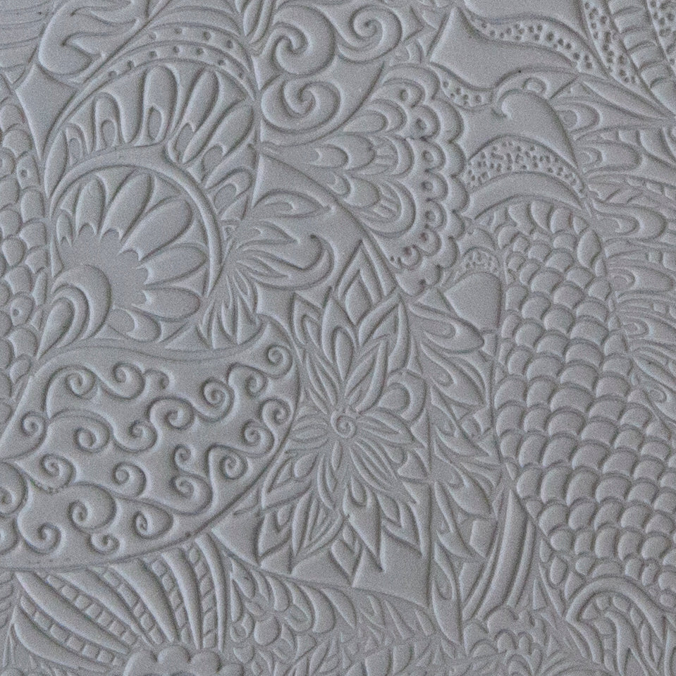 sample in clay of Mega Texture Tile - Jungle Love. Use to impress texture in soft clays. Mega Texture Tiles are perfect for projects both large and small. Mega Tiles measure 9-1/4" x 6" and are about 7 times larger than Texture Tiles. These textures are flexible, washable and can be used with any soft clay.