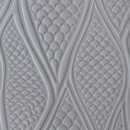 sample in clay of Mega Texture Tile - Be Scaled Use to impress texture in soft clays. Mega Texture Tiles are perfect for projects both large and small. Mega Tiles measure 9-1/4" x 6" and are about 7 times larger than Texture Tiles. These textures are flexible, washable and can be used with any soft clay.