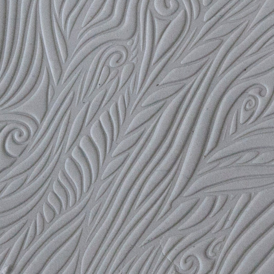sample in clay of Mega Texture Tile - Blowing in the Wind. Use to impress texture in soft clays. Mega Texture Tiles are perfect for projects both large and small. Mega Tiles measure 9-1/4" x 6" and are about 7 times larger than Texture Tiles. These textures are flexible, washable and can be used with any soft clay.