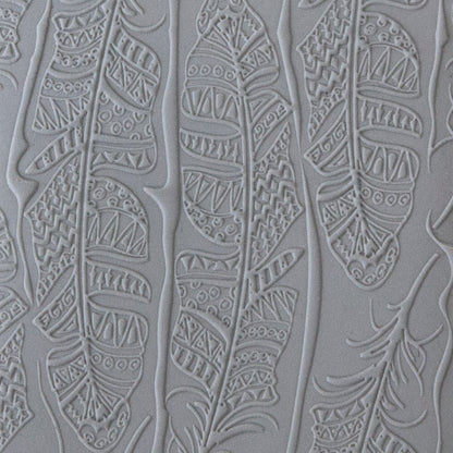 sample in clay of Mega Texture Tile - Tribal Feather Fineline. Use to impress texture in soft clays. Mega Texture Tiles are perfect for projects both large and small. Mega Tiles measure 9-1/4" x 6" and are about 7 times larger than Texture Tiles. These textures are flexible, washable and can be used with any soft clay.