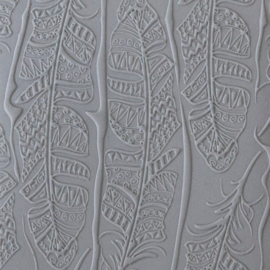 sample in clay of Mega Texture Tile - Tribal Feather Fineline. Use to impress texture in soft clays. Mega Texture Tiles are perfect for projects both large and small. Mega Tiles measure 9-1/4" x 6" and are about 7 times larger than Texture Tiles. These textures are flexible, washable and can be used with any soft clay.