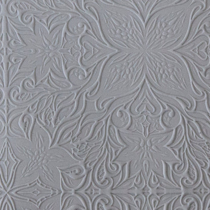 sample in clay of Mega Texture Tile - Woodcut Floral. Use to impress texture in soft clays. Mega Texture Tiles are perfect for projects both large and small. Mega Tiles measure 9-1/4" x 6" and are about 7 times larger than Texture Tiles. These textures are flexible, washable and can be used with any soft clay.