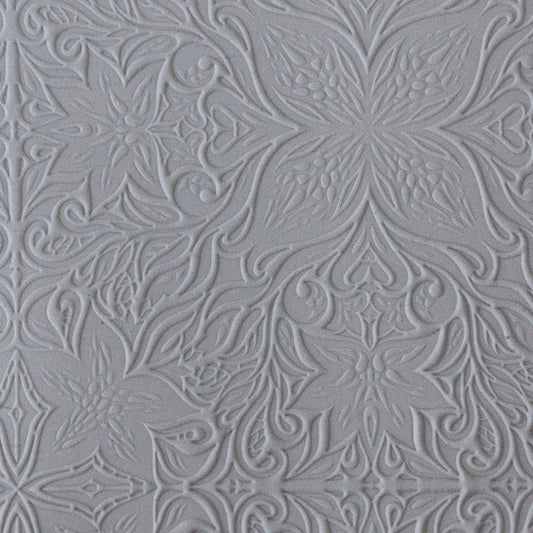 sample in clay of Mega Texture Tile - Woodcut Floral. Use to impress texture in soft clays. Mega Texture Tiles are perfect for projects both large and small. Mega Tiles measure 9-1/4" x 6" and are about 7 times larger than Texture Tiles. These textures are flexible, washable and can be used with any soft clay.