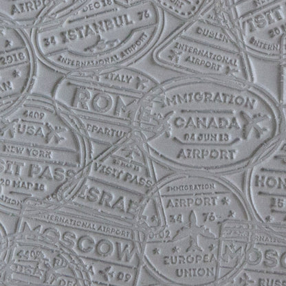 sample in clay of Mega Texture Tile - Bon Voyage. Use to impress texture in soft clays. Mega Texture Tiles are perfect for projects both large and small. Mega Tiles measure 9-1/4" x 6" and are about 7 times larger than Texture Tiles. These textures are flexible, washable and can be used with any soft clay.