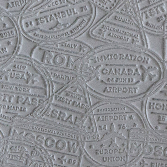 sample in clay of Mega Texture Tile - Bon Voyage. Use to impress texture in soft clays. Mega Texture Tiles are perfect for projects both large and small. Mega Tiles measure 9-1/4" x 6" and are about 7 times larger than Texture Tiles. These textures are flexible, washable and can be used with any soft clay.