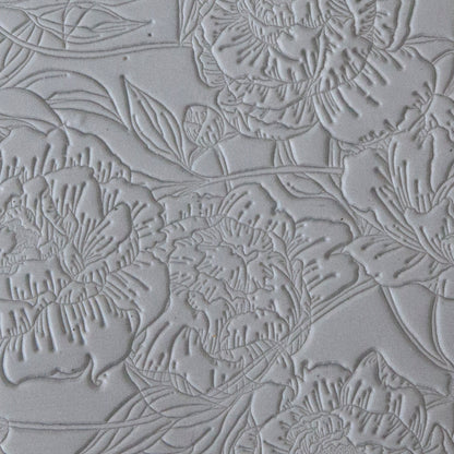 sample in clay of Mega Texture Tile - Peony Wallpaper. Use to impress texture in soft clays. Mega Texture Tiles are perfect for projects both large and small. Mega Tiles measure 9-1/4" x 6" and are about 7 times larger than Texture Tiles. These textures are flexible, washable and can be used with any soft clay.