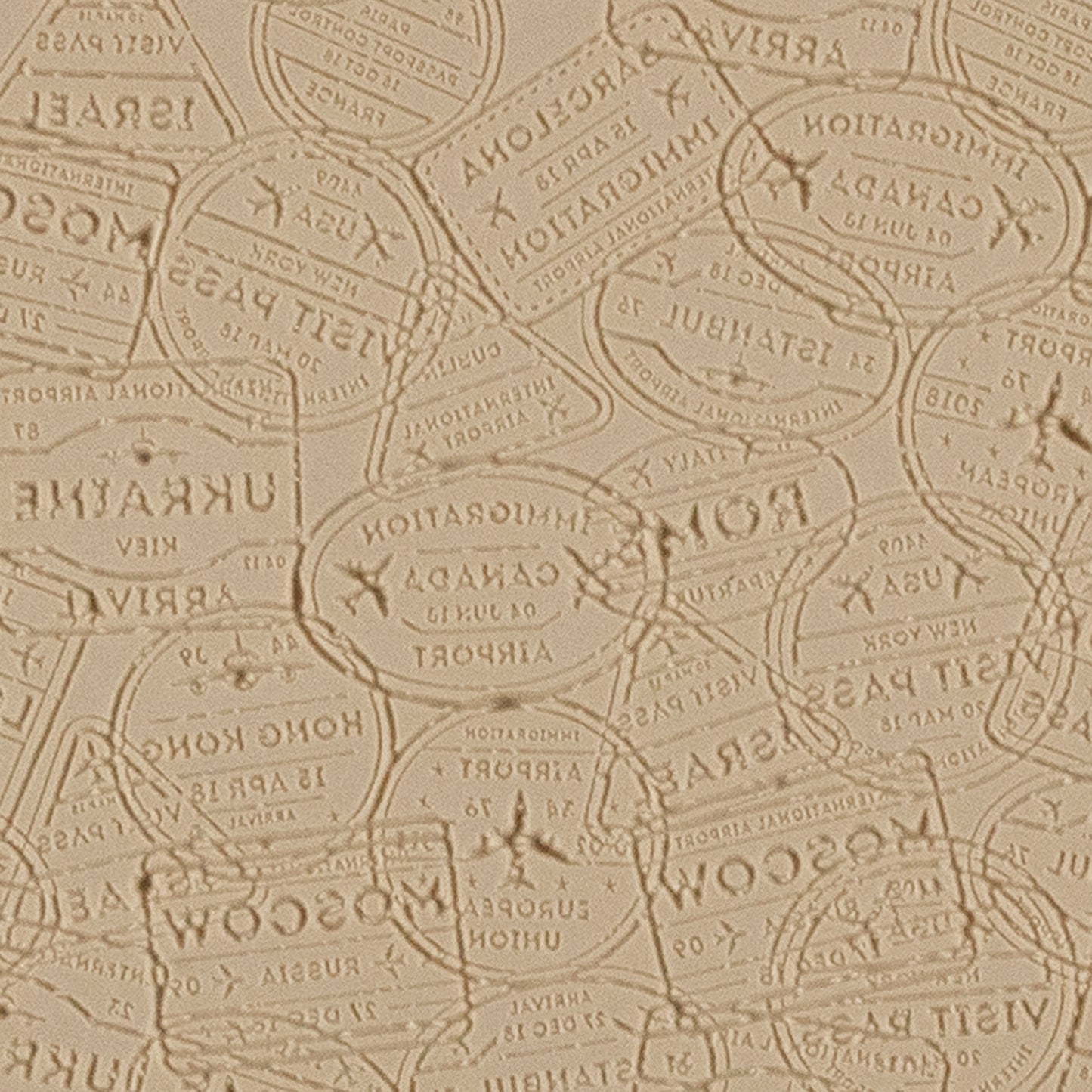 Mega Texture Tile - Bon Voyage Embossed. Use to impress texture in soft clays. Mega Texture Tiles are perfect for projects both large and small. Mega Tiles measure 9-1/4" x 6" and are about 7 times larger than Texture Tiles. These textures are flexible, washable and can be used with any soft clay.