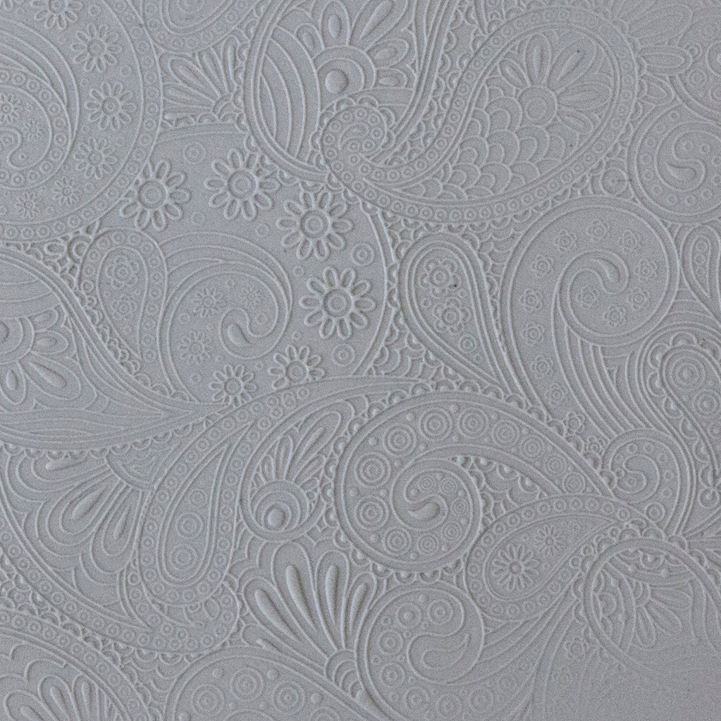 sample in clay of Mega Texture Tile - Waves of Paisley Embossed. Use to impress texture in soft clays. Mega Texture Tiles are perfect for projects both large and small. Mega Tiles measure 9-1/4" x 6" and are about 7 times larger than Texture Tiles. These textures are flexible, washable and can be used with any soft clay.