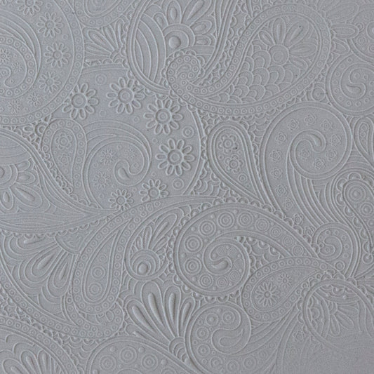 sample in clay of Mega Texture Tile - Waves of Paisley Embossed. Use to impress texture in soft clays. Mega Texture Tiles are perfect for projects both large and small. Mega Tiles measure 9-1/4" x 6" and are about 7 times larger than Texture Tiles. These textures are flexible, washable and can be used with any soft clay.