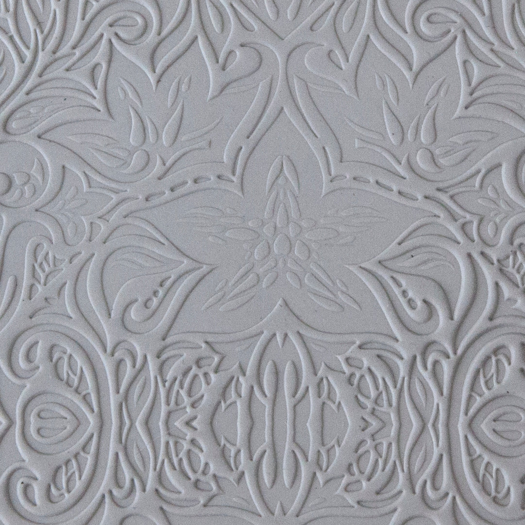 sample in clay of Mega Texture Tile - Lavish Lillies. Use to impress texture in soft clays. Mega Texture Tiles are perfect for projects both large and small. Mega Tiles measure 9-1/4" x 6" and are about 7 times larger than Texture Tiles. These textures are flexible, washable and can be used with any soft clay.