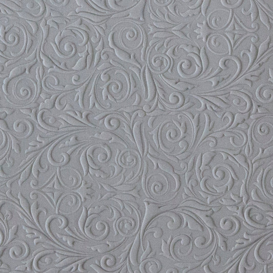 sample in clay of Mega Texture Tile - Damask. Use to impress texture in soft clays. Mega Texture Tiles are perfect for projects both large and small. Mega Tiles measure 9-1/4" x 6" and are about 7 times larger than Texture Tiles. These textures are flexible, washable and can be used with any soft clay.