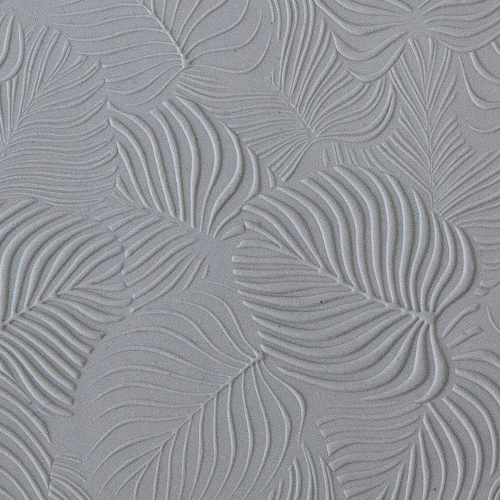 sample in clay of Mega Texture Tile - In the Tropics. Use to impress texture in soft clays. Mega Texture Tiles are perfect for projects both large and small. Mega Tiles measure 9-1/4" x 6" and are about 7 times larger than Texture Tiles. These textures are flexible, washable and can be used with any soft clay.