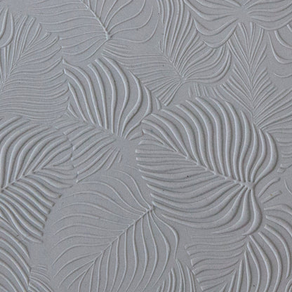 sample in clay of Mega Texture Tile - In the Tropics. Use to impress texture in soft clays. Mega Texture Tiles are perfect for projects both large and small. Mega Tiles measure 9-1/4" x 6" and are about 7 times larger than Texture Tiles. These textures are flexible, washable and can be used with any soft clay.