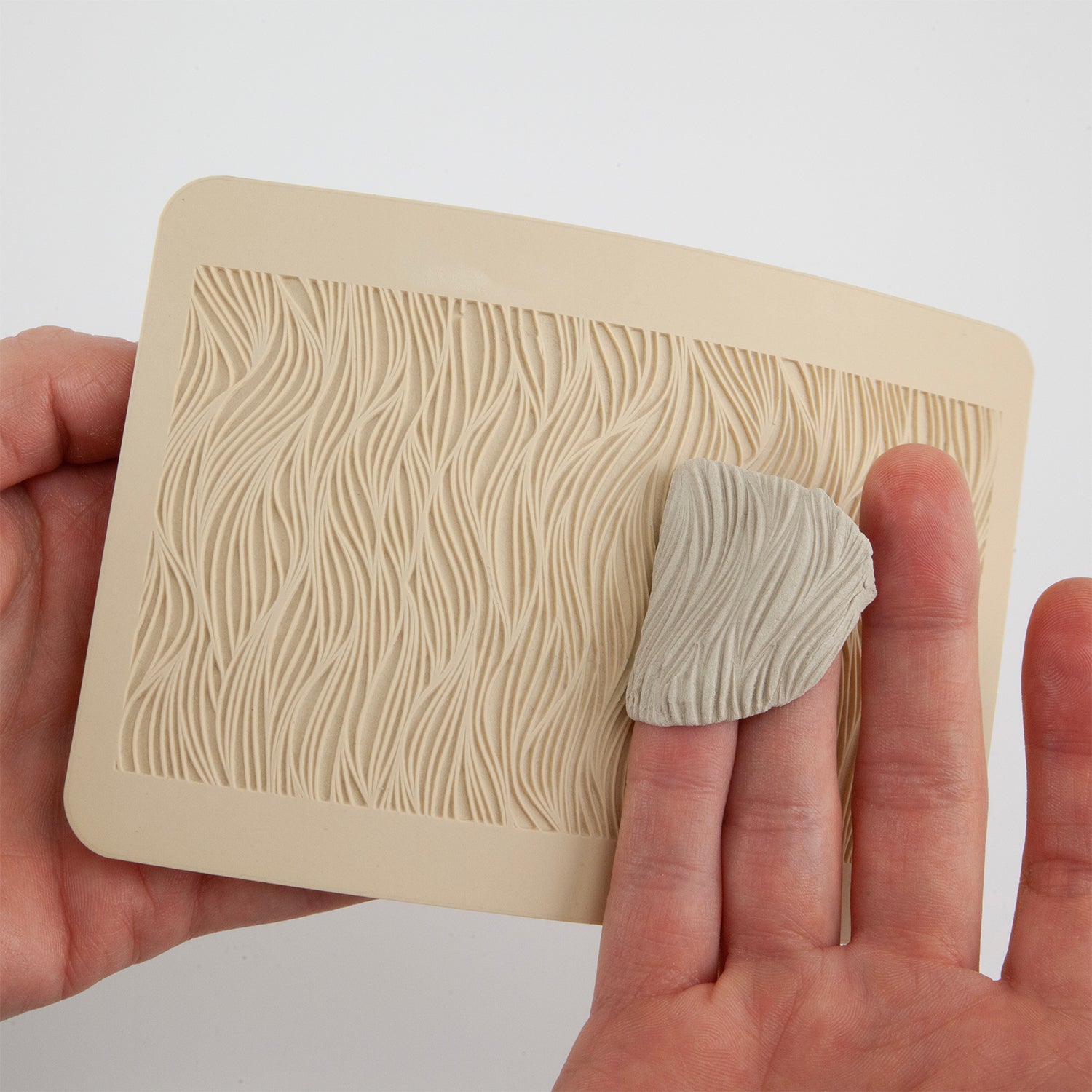 texture tiles sprayed with coolslip so clay releases easily