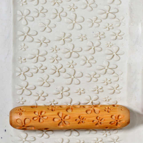 Large Wooden Hand Roller - Daisies pressed into clay 