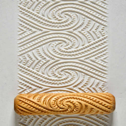Large Wooden Hand Roller - Maori Spirals rolled into clay