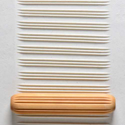 Large Wooden Hand Roller - Lines and Spaces rolled into clay