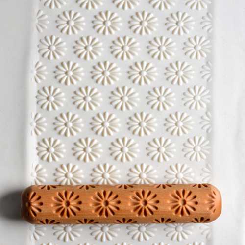 Large Wooden Hand Roller - Geometric Daisies rolled into clay