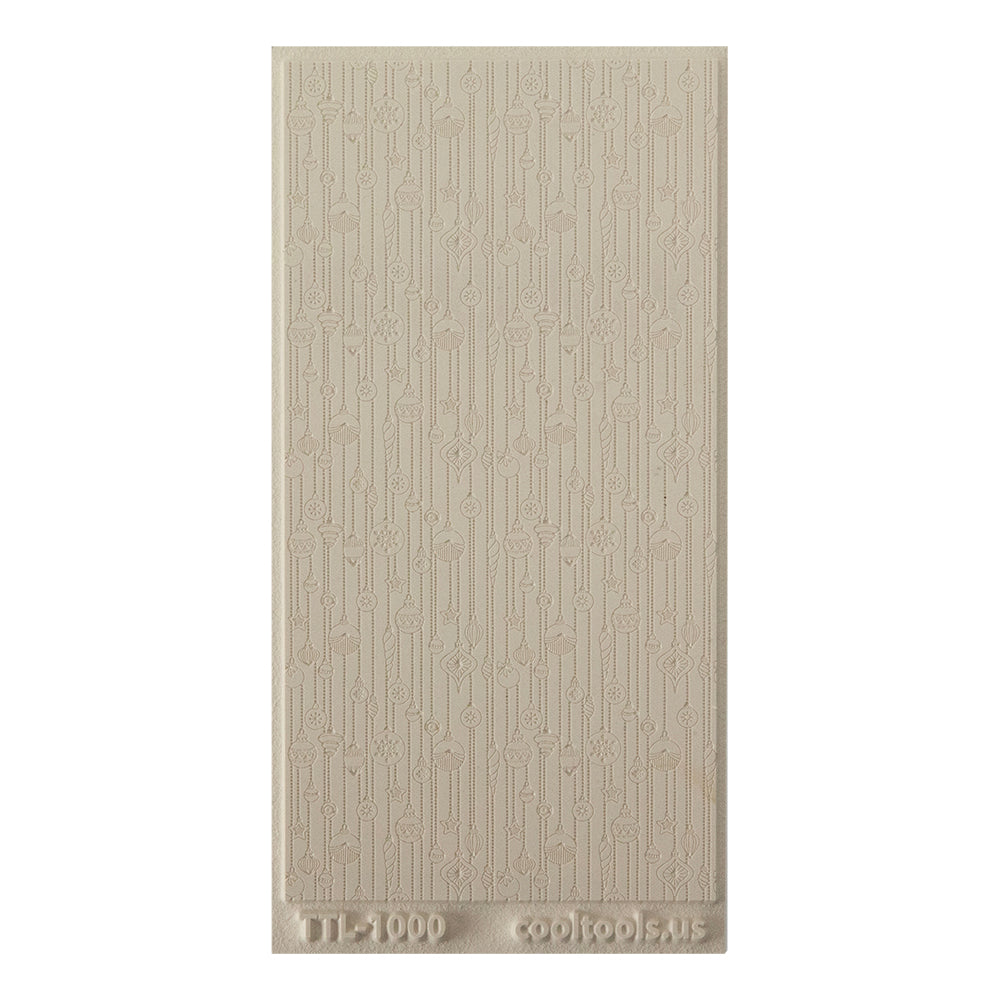 Texture Tile - 'Tis the Season Embossed. Beige Texture Tiles are flexible, washable and can be used with any soft clay. Spritz with CoolSlip or dust on Dry Powder Release for stick-free impressions when using metal clay and polymer clay.