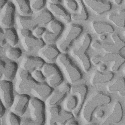 Texture Tile - Jaguar Print sample rolled into gray polymer clay