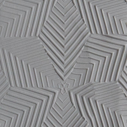 Texture Tile - Motley sample rolled into gray polymer clay