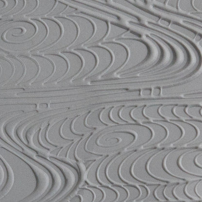 Texture Tile - A River Runs Through Embossed sample rolled into gray polymer clay
